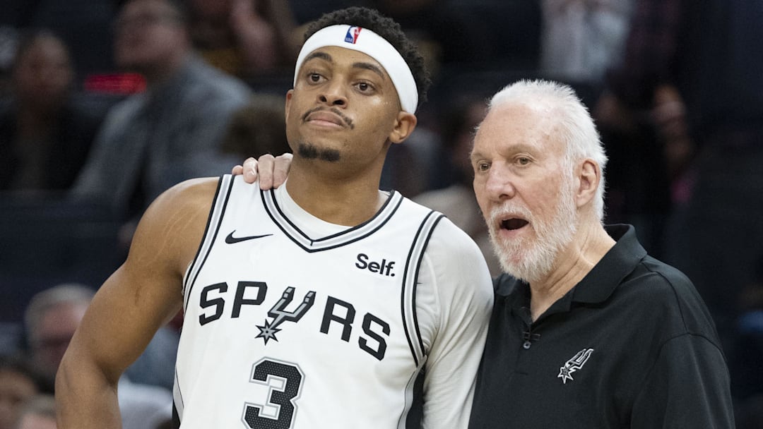 November 24, 2023; San Francisco, California, USA; San Antonio Spurs head coach Gregg Popovich (Right) talks to forward Keldon Johnson (3) during the third quarter against the Golden State Warriors at Chase Center. Mandatory Credit: Kyle Terada-Imagn Images