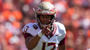 Sep 23, 2023; Clemson, South Carolina, USA; Florida State Seminoles quarterback Jordan Travis (13) in the first half against the Clemson Tigers at Memorial Stadium. Mandatory Credit: David Yeazell-Imagn Images