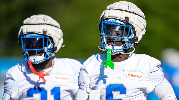 Detroit Lions cornerback Terrion Arnold (6), center, and cornerback Amik Robertson (21) practice during training camp Detroit Lions cornerback Terrion Arnold (6), center, and cornerback Amik Robertson (21) practice during training camp