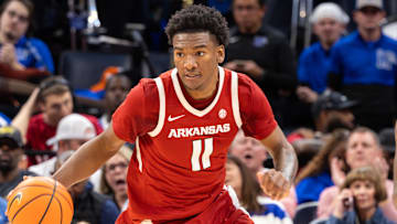 Arkansas Razorbacks guard Karter Knox (11) dribbles the ball up the court against the Memphis Tigers during the second half at FedEx Forum.