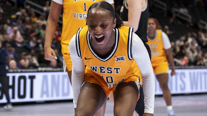Mar 7, 2026; Kansas City, MO, USA;  West Virginia Mountaineers guard Jordan Harrison (10) reacts to an and one foul by guard Gia Cooke (3) during the second half at T-Mobile Center. Mandatory Credit: Nick Tre. Smith-Imagn Images