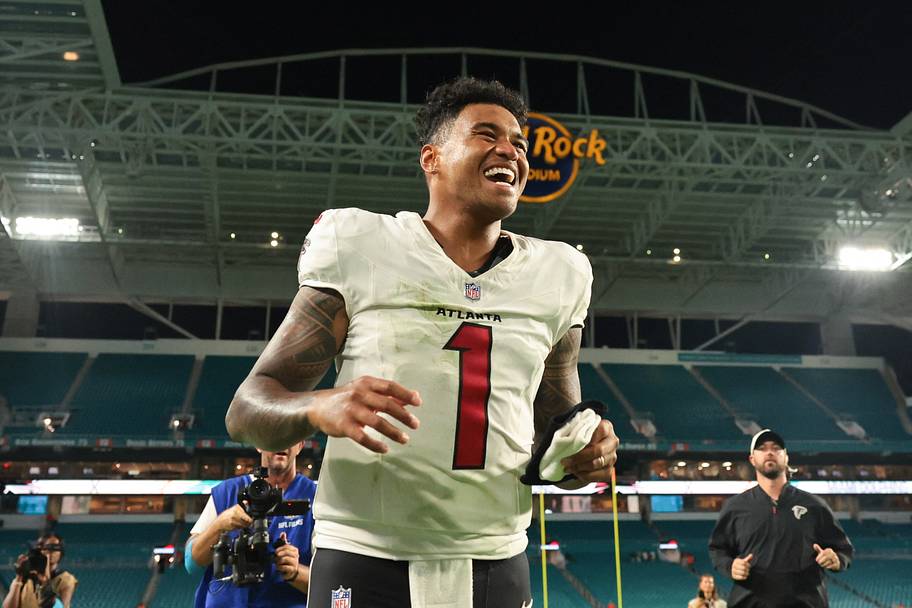 Tua Tagovailoa smiles as he walks off the field.