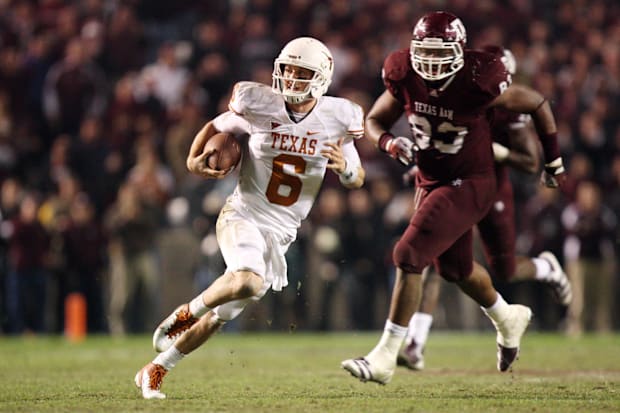 Case McCoy scrambles from Texas A&M Aggies defensive lineman Tony Jerod-Eddie during the 2011 game.