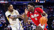 Feb 8, 2025; Baton Rouge, Louisiana, USA;  Mississippi Rebels forward Malik Dia (0) dribbles against LSU Tigers forward Daimion Collins (10) during the second half at Pete Maravich Assembly Center. Mandatory Credit: Stephen Lew-Imagn Images