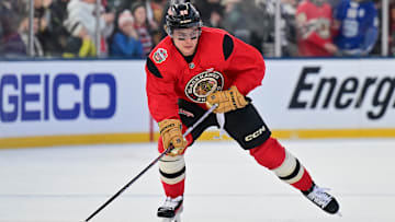 Dec 30, 2024; Chicago, Illinois, USA; Chicago Blackhawks center Connor Bedard (98) skates with the puck during a practice session prior to the Winter Classic ice hockey game against the St. Louis Blues at Wrigley Field. Mandatory Credit: Daniel Bartel-Imagn Images