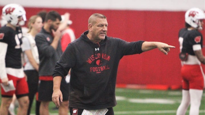 Wisconsin offensive coordinator Phil Longo works with the team's quarterbacks during practice on Tuesday April 9, 2024 at the McClain Center in Madison, Wisconsin.