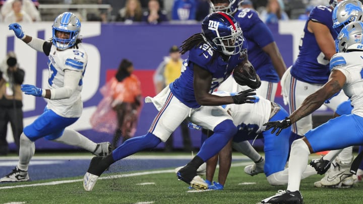 Aug 8, 2024; East Rutherford, New Jersey, USA;  New York Giants running back Dante Miller (25) runs the ball during the game against the Detroit Lions at MetLife Stadium. Mandatory Credit: Scott Rausenberger-USA TODAY Sports