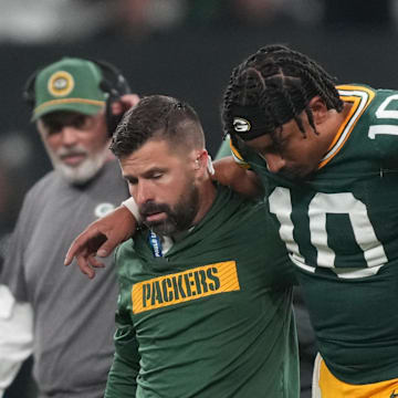 Sep 6, 2024; Sao Paulo, BRA; Green Bay Packers quarterback Jordan Love (10) is assisted off the field after an injury during the second half against the Philadelphia Eagles at Neo Quimica Arena. Mandatory Credit: Kirby Lee-Imagn Images