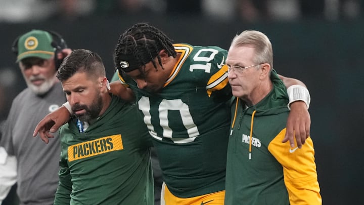 Sep 6, 2024; Sao Paulo, BRA; Green Bay Packers quarterback Jordan Love (10) is assisted off the field after an injury during the second half against the Philadelphia Eagles at Neo Quimica Arena. Mandatory Credit: Kirby Lee-Imagn Images