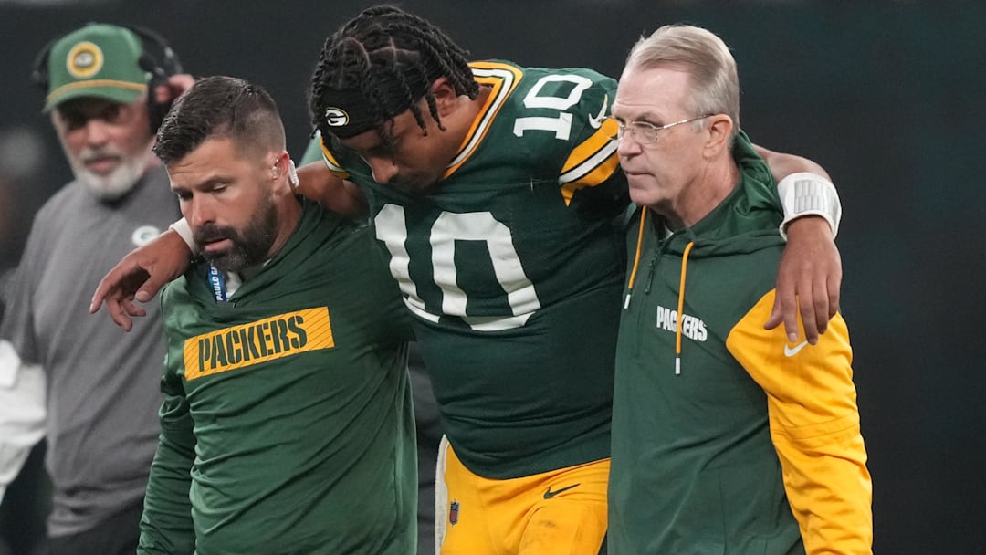 Sep 6, 2024; Sao Paulo, BRA; Green Bay Packers quarterback Jordan Love (10) is assisted off the field after an injury during the second half against the Philadelphia Eagles at Neo Quimica Arena. Mandatory Credit: Kirby Lee-Imagn Images