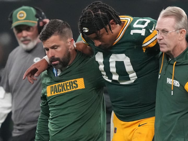 Sep 6, 2024; Sao Paulo, BRA; Green Bay Packers quarterback Jordan Love (10) is assisted off the field after an injury during the second half against the Philadelphia Eagles at Neo Quimica Arena. Mandatory Credit: Kirby Lee-Imagn Images