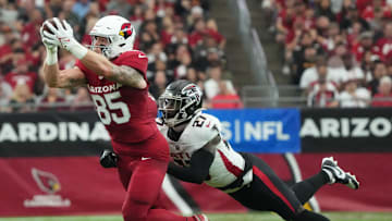 Arizona Cardinals tight end Trey McBride (85) catches a pass over Atlanta Falcons safety Richie