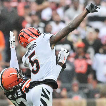 Sep 10, 2023; Cleveland, Ohio, USA; Cleveland Browns cornerback Martin Emerson Jr. (23) and Cincinnati Bengals wide receiver Tee Higgins (5) go for a pass during the second half at Cleveland Browns Stadium. Mandatory Credit: Ken Blaze-USA TODAY Sports