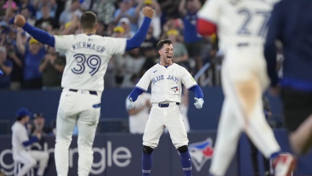 Ernie Clement celebrates after his walk-off single in the ninth gave the Blue Jays a 6-5 win Friday night.