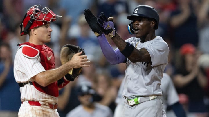 Jul 30, 2024; Philadelphia, Pennsylvania, USA; New York Yankees third base Jazz Chisholm Jr. (13) reacts in front of Philadelphia Phillies catcher J.T. Realmuto (10) after hitting a three RBI home run during the seventh inning at Citizens Bank Park. Mandatory Credit: Bill Streicher-USA TODAY Sports