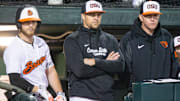 Oregon State head coach Mitch Canham, center, watches his team compete against San Diego during an NCAA college baseball game at Goss Stadium on Friday, March 7, 2025, in Corvallis, Ore.