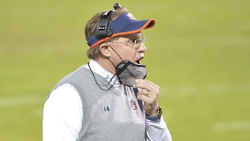 Dec 12, 2020; Starkville, Mississippi, USA;  Auburn Tigers head coach Gus Malzahn shouts during the first quarter of the game against the Mississippi State Bulldogs at Davis Wade Stadium at Scott Field. Mandatory Credit: Matt Bush-Imagn Images
