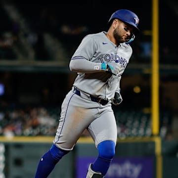 Aug 4, 2025; Denver, Colorado, USA; Toronto Blue Jays designated hitter Bo Bichette (11) rounds the bases on a three run home run in the eighth inning against the Colorado Rockies at Coors Field. 