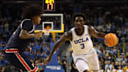 Nov 7, 2025; Los Angeles, California, USA;  UCLA Bruins forward Eric Dailey Jr. (3) dribbles the ball against Pepperdine Waves guard Aaron Clark (3) during the second half at Pauley Pavilion presented by Wescom Financial. Mandatory Credit: Kiyoshi Mio-Imagn Images