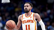 Apr 2, 2025; Dallas, Texas, USA; Atlanta Hawks guard Trae Young (11) dribbles against the Dallas Mavericks  during the second half at American Airlines Center. Mandatory Credit: Kevin Jairaj-Imagn Images