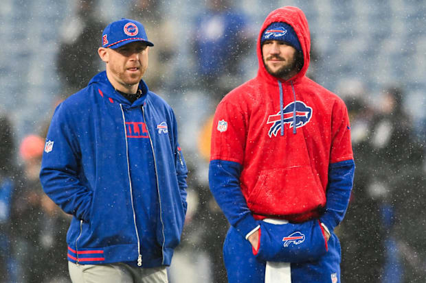 Buffalo Bills QB Josh Allen speaks with Buffalo Bills Offensive Coordinator Joe Brady before the game against the Ravens