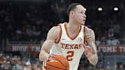 Texas Longhorns guard Chendall Weaver drives the ball against Southern University Jaguars forward Ashton Magee during the first half at Moody Center. 