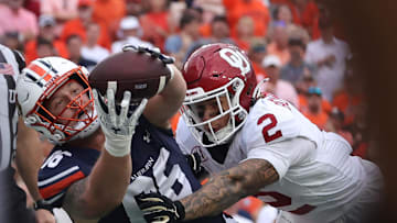 Sep 28, 2024; Auburn, Alabama, USA;  Auburn Tigers tight end Luke Deal (86) catches a pass for a touchdown as Oklahoma Sooners defensive back Billy Bowman Jr. (2) defends during the fourth quarter at Jordan-Hare Stadium. Mandatory Credit: John Reed-Imagn Images
