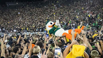 The Oregon Duck crowd surfs as fans storm the field as the No. 3 Oregon Ducks host the No. 2 Ohio State Buckeyes Saturday, Oct. 12, 2024 at Autzen Stadium in Eugene, Ore.