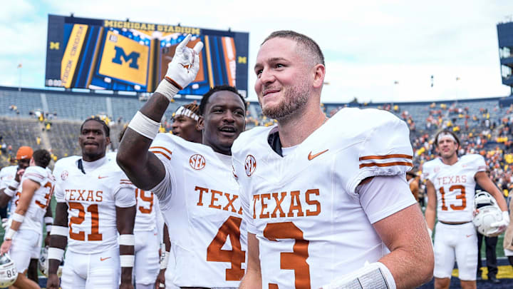 Texas quarterback Quinn Ewers (3) and teammates celebrate 31-12 win over Michigan at Michigan Stadium in Ann Arbor on Saturday, September 7, 2024.