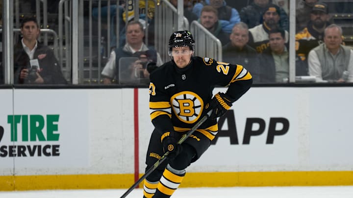 Jan 13, 2026; Boston, Massachusetts, USA; Boston Bruins defenseman Henri Jokiharju (20) skates with the puck during the first period of the game against the Detroit Red Wings at TD Garden. Mandatory Credit: Natalie Reid-Imagn Images