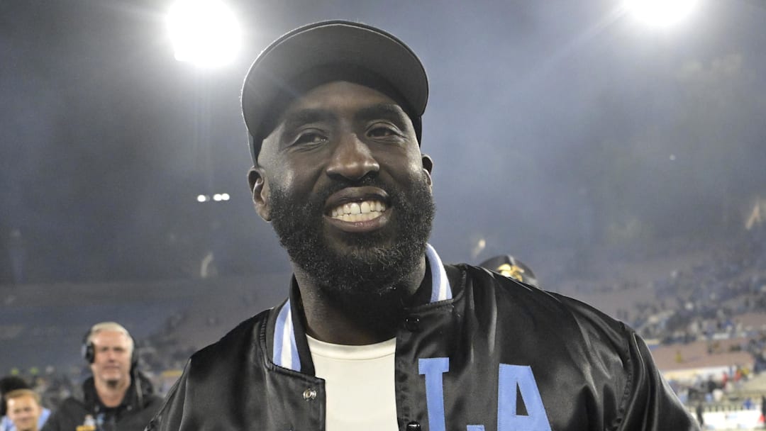Nov 8, 2024; Pasadena, California, USA;  UCLA Bruins head coach DeShaun Foster leaves the field with the game ball after defeating the Iowa Hawkeyes at the Rose Bowl. Mandatory Credit: Jayne Kamin-Oncea-Imagn Images