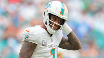 Oct 12, 2025; Miami Gardens, Florida, USA; Miami Dolphins quarterback Tua Tagovailoa (1) reacts on the field against the Los Angeles Chargers during the third quarter at Hard Rock Stadium. Mandatory Credit: Sam Navarro-Imagn Images