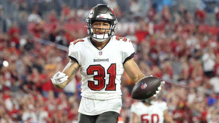 Jan 9, 2022; Tampa, Florida, USA; Tampa Bay Buccaneers safety Antoine Winfield Jr. (31) recovers the ball the ball against the Carolina Panthers during the second half at Raymond James Stadium. Mandatory Credit: Kim Klement-USA TODAY Sports