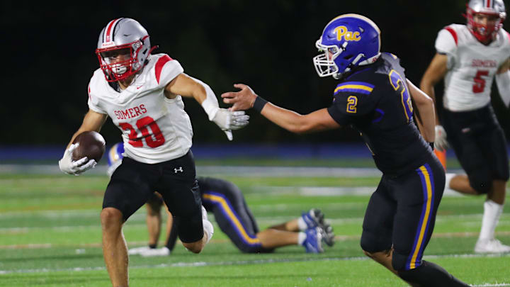 Somers Dean Palazzolo (30) looks for some running room in the Mahopac defense on a first half run during football action at Mahopac High School Sept. 20, 2024.