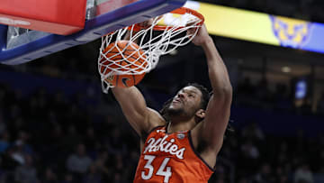 Feb 24, 2024; Pittsburgh, Pennsylvania, USA;  Virginia Tech Hokies forward Mylyjael Poteat (34) dunks against the Pittsburgh Panthers during the second half at the Petersen Events Center. The Panthers won 79-64. Mandatory Credit: Charles LeClaire-USA TODAY Sports