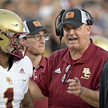 Sep 2, 2024; Tallahassee, Florida, USA; Boston College Eagles quarterback Thomas Castellanos (1) speaks with head coach Bill O'Brien before the game against the Florida State Seminoles at Doak S. Campbell Stadium. Mandatory Credit: Melina Myers-Imagn Images