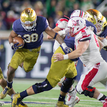 Sep 30, 2017; South Bend, IN, USA; Notre Dame Fighting Irish running back Deon McIntosh (38) runs the ball in the second half of the game against the Miami (Oh) Redhawks at Notre Dame Stadium.