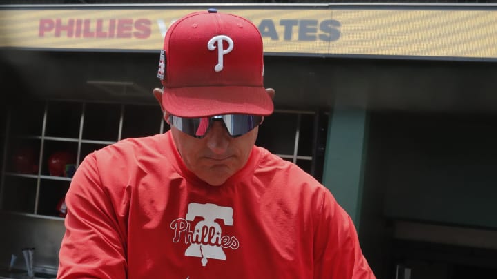 Jul 21, 2024; Pittsburgh, Pennsylvania, USA;  Philadelphia Phillies Philadelphia Phillies manager Rob Thomson (59) prepares in the dugout to play the Pittsburgh Pirates at PNC Park