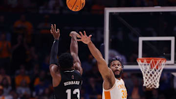 Mississippi State Bulldogs guard Josh Hubbard (13) shoots over the reach of Tennessee Volunteers guard Josiah-Jordan James (30) during their quarterfinal game of the SEC Men's Basketball Tournament at Bridgestone Arena in Nashville, Tenn., Friday, March 15, 2024.