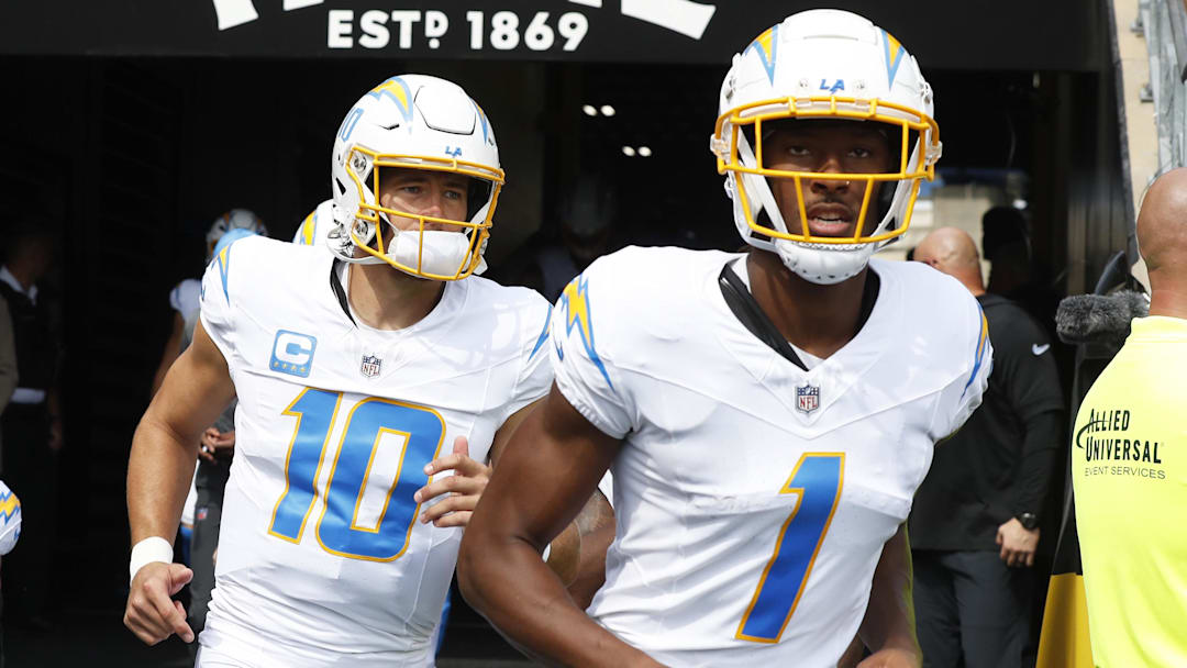 Sep 22, 2024; Pittsburgh, Pennsylvania, USA;  Los Angeles Chargers quarterback Justin Herbert (10) and wide receiver Quentin Johnston (1) take the field against the Pittsburgh Steelers at Acrisure Stadium. Mandatory Credit: Charles LeClaire-Imagn Images