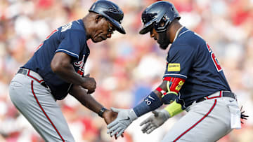Jun 24, 2023; Cincinnati, Ohio, USA; Atlanta Braves designated hitter Marcell Ozuna (20) celebrates with third base coach Ron Washington (37) after hitting a solo home run in the seventh inning at Great American Ball Park. Mandatory Credit: Katie Stratman-Imagn Images