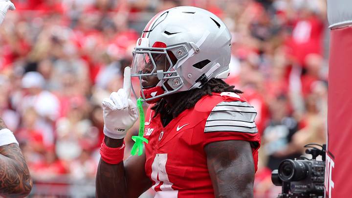 Sep 5, 2026; Columbus, Ohio, USA;  Ohio State Buckeyes wide receiver Jeremiah Smith (4) celebrates his touchdown catch during the second quarter against the Ball State Cardinals at Ohio Stadium.  Mandatory Credit: Joseph Maiorana-Imagn Images