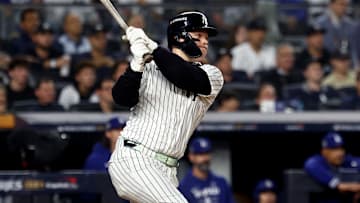 Oct 30, 2024; New York, New York, USA; New York Yankees outfielder Alex Verdugo (24) hits a RBI single during the second inning against the Los Angeles Dodgers in game five of the 2024 MLB World Series at Yankee Stadium. Mandatory Credit: Vincent Carchietta-Imagn Images