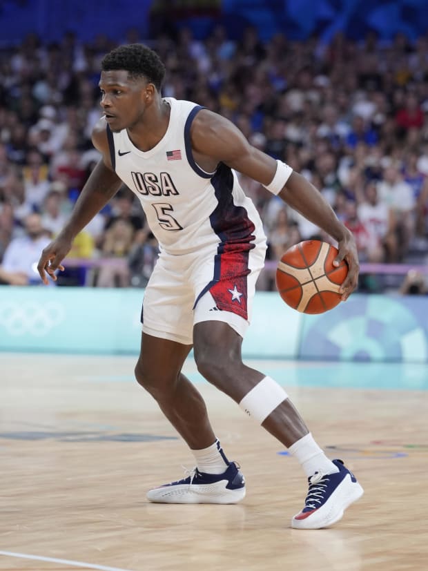 Team USA guard Anthony Edwards dribbles the ball in the Olympics.