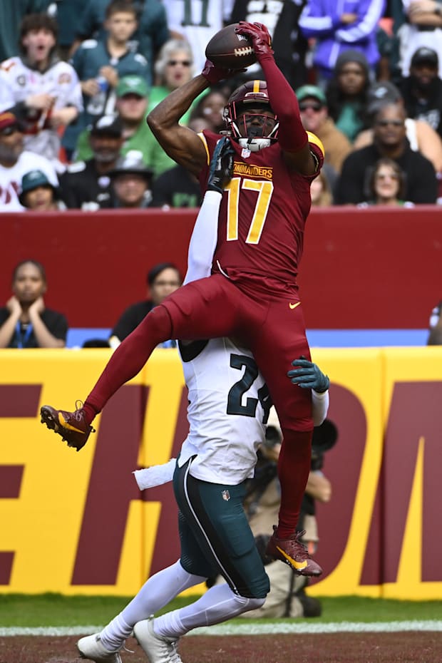 Washington Commanders wide receiver Terry McLaurin scores a touchdown over Philadelphia Eagles cornerback James Bradberry