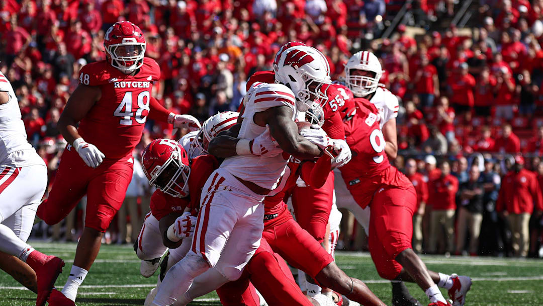 Wisconsin running back Tawee Walker scores a rushing touchdown as Rutgers defensive back Flip Dixon defends during the first half at SHI Stadium in Piscataway, N.J., on Oct. 12, 2024.