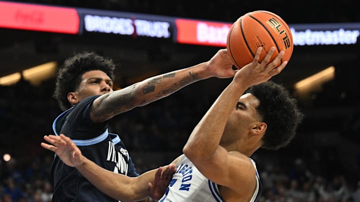 Villanova Wildcats guard Acaden Lewis (55) defends on a shot attempt from Creighton Bluejays guard Nik Graves (5) during the second half at CHI Health Center Omaha.