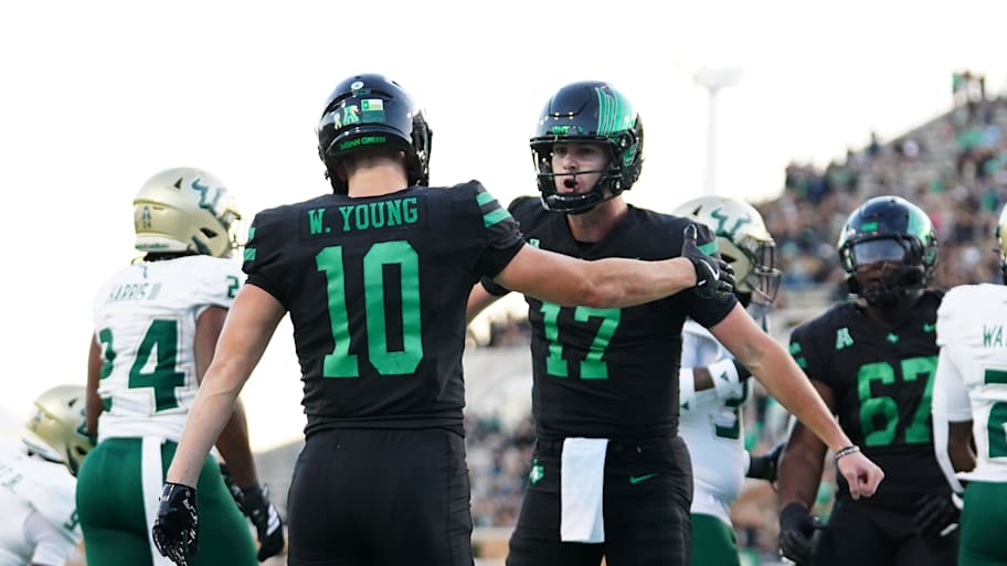 North Texas Mean Green quarterback Drew Mestemaker celebrates a touchdown with wide receiver Wyatt Young.