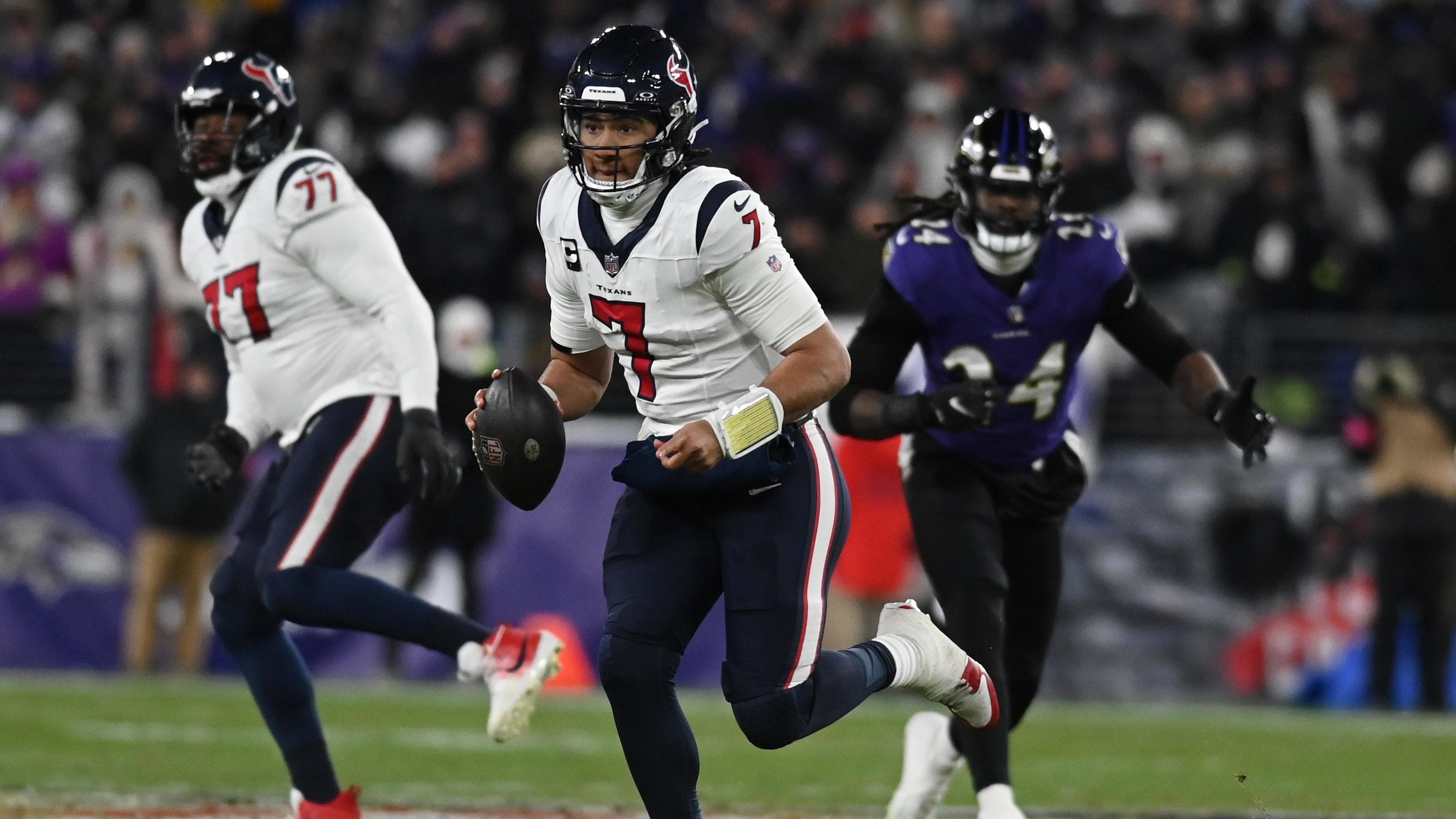 Houston Texans quarterback C.J. Stroud (7) runs the ball against the Baltimore Ravens.