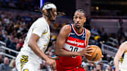 Apr 8, 2025; Indianapolis, Indiana, USA; Washington Wizards forward Alex Sarr (20) dribbles the ball while Indiana Pacers center Myles Turner (33)  defends in the second half at Gainbridge Fieldhouse. Mandatory Credit: Trevor Ruszkowski-Imagn Images